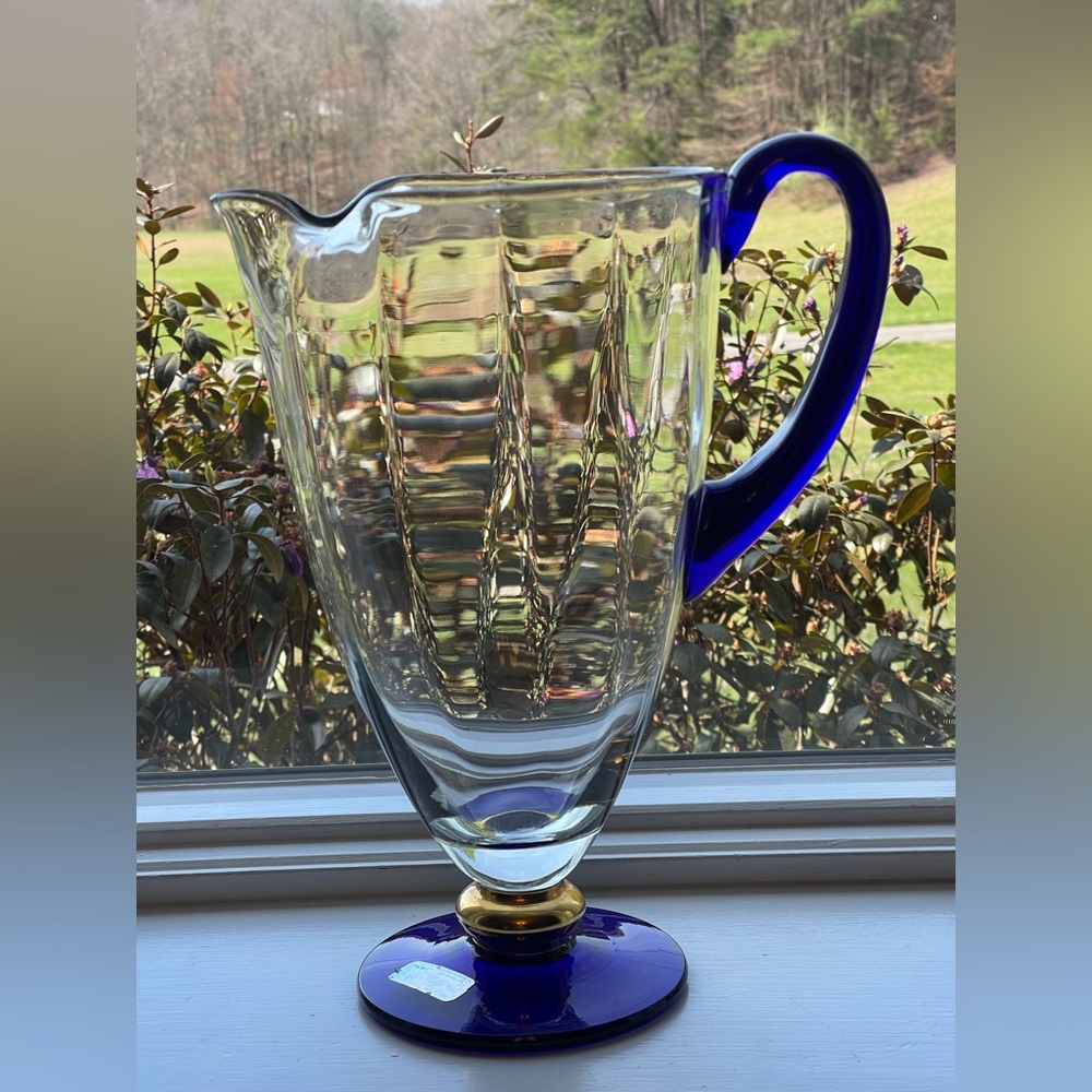 This item is a vintage, hand-blown Romanian crystal pitcher